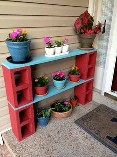 an outdoor shelf with potted plants on it and two flower pots sitting on top