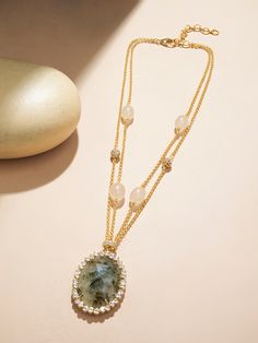 Embark on an artistic journey with our jade necklace, a masterpiece that intertwines Polki, 22kt gold plated chains, micro plated brass rings, fresh water pearls, and intricately carved jade drops. This exquisite piece is not just jewelry; it's a canvas of craftsmanship and creativity. Ideal for cultural events, festive occasions, and artistic soirées, where each element tells a unique story, this necklace is a testament to the fusion of tradition and contemporary artistry. Finish: 22KT Gold Pla Luxury Oval Jade Necklaces, Elegant Jade Necklace With Adjustable Chain, Gold Jade Necklace Fine Jewelry, Gold Jade Jewelry With Stones, Gold Jade Necklace In Fine Jewelry Style, Fine Jewelry In Gold With Jade, Fine Jewelry Gold Necklace With Jade, Gold Necklaces With Oval Pendant And Stones, Fine Gold Jade Jewelry