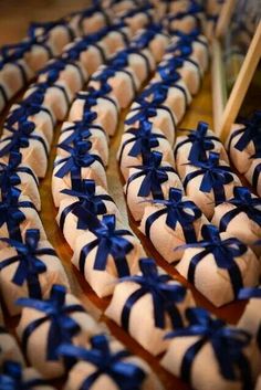 blue and white cookies with bows on them