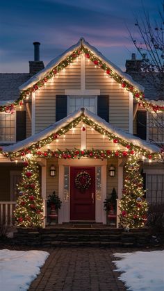 a house decorated with christmas lights and wreaths