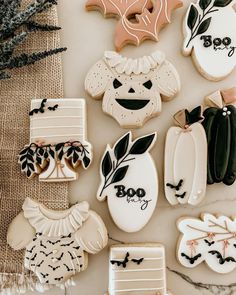 decorated cookies are displayed on a table