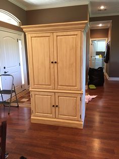 an empty living room with hard wood floors