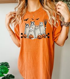 Ghost Cats t-shirt.Bats Halloween shirt.Cat shirt.Comfort Colors Halloween Shirt.Ghost cat with broom shirt.Spooky Season tee.Pumpkin tshirt Comfort Colors® Retro American Mama t-shirt. 4th July tee. Gift for American Mom. Vintage USA top. Freedom t-shirt for her. Gift for her.  Comfort Colors 1717 garment-dyed t-shirt  Item Details::.. - Fully customizable tee made 100% with ring-spun cotton. The soft-washed, garment-dyed fabric brings extra coziness to your wardrobe while the relaxed fit makes Short Sleeve T-shirt With Cat Print For Halloween, Spooky Cat Design Tops For Fall, Spooky Halloween T-shirt With Cat Design, Spooky Cat Print Crew Neck T-shirt, Halloween Cat Design Graphic Tee, Halloween Cat Print Graphic Tee, Halloween Graphic Tee With Cat Design, Spooky Cat Print Tops For Fall, Spooky Fall Tops With Cat Print