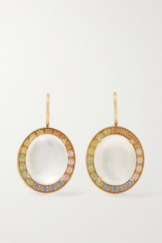 Andrea Fohrman's earrings are centered with beautifully iridescent moonstones, which are said to enhance intuition and bring good fortune to the wearer. They're handcrafted from 18-karat gold and framed by pastel sapphires. White Multi-stone Earrings Fine Jewelry, Luxury White Oval Earrings, Luxury White Earrings With Gemstone Accents, Elegant White Multi-stone Earrings, White Fine Jewelry Earrings With Gemstone Accents, Luxury Multi-stone Moonstone Jewelry, Elegant Moonstone Earrings With Gemstone Accents, Elegant Yellow Gold Moonstone Earrings, White Gemstone Accented Round Earrings