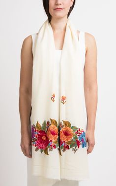 Feel the epitome of floral and radiant in this creamy embroidered shawl adorned with colourful embroidery. Long-lasting and Intricate floral hand embroidery are timelessly classic which provide the utmost luxury, uniqueness, and special treatment. An ideal one-off statement piece. Take it with you on your travels or simply drape it around your shoulder for an elegant touch to your appearance. This wool shawl is designed to keep you cosy and stylish during the winter season. It redefines festive Bridesmaid Pashmina, Black Pashmina, Colourful Embroidery, Floral Hand Embroidery, Personalized Scarves, Shawl Wedding, Embroidered Shawl, Silk Stoles, Evening Shawls