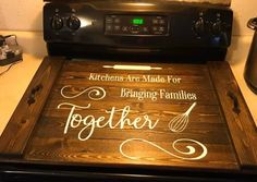 a kitchen stove with the words together written on it