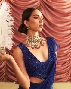 Step into refined elegance with this electric blue embellished choli, intricately adorned for a touch of glamour. Paired with a pre-draped ruffle sari, this ensemble effortlessly blends traditional charm with modern flair, perfect for making a statement at any celebration. Ruffle Saree, Vacuum Storage, Cascading Ruffles, Ready To Wear Saree, Sleeves Blouse, Wear Saree, Cocktail Parties, Blouse Length, Embroidered Blouse