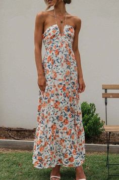 Discover the perfect blend of bold and feminine in our Plunge Halter Backless Floral Swing Maxi Dress. Featuring a vibrant white, orange, and navy floral print, this dress boasts a flattering tie halter neckline, empire waist, and flowy skirt for a stunning silhouette. The open back adds a touch of allure to this must-have summer dress. Size Guide Size Bust Length Hip Waist S 34.25 50.00 49.61 28.35 M 35.83 50.39 51.18 29.92 L 38.19 50.79 53.54 32.28 XL 40.55 51.18 55.91 34.65 Tuxedo Suit, Maxi Dress Formal, Dress Formal, Flowy Skirt, Navy Floral, Halter Neckline, Empire Waist, Boutique Clothing, Summer Dress