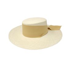 Long Brim Cordovan Hat With Maxi Bow The Panama Hat, also known as Montecristi Hat is a traditional Ecuadorian model made with 100% Toquilla Straw, a natural fiber known for its quality and beauty. The perfect beach-to-city accessory, elegant, yet fresh and versatile for original matches with different kinds of fashion. -We ship with DHL Express. Shipping takes approximately 3 to 5 days to arrive depending on the destination. -Need Help? Please contact: customercare@sensistudio.com -All Sales Ar Natural Toquilla Straw Hat With Flat Crown, Traditional Natural Straw Hat For Spring, Cream Toquilla Straw Hat Bands For Vacation, Natural Straw Sun Hat With Flat Crown, White Brimmed Boater Hat In Toquilla Straw, White Brimmed Toquilla Straw Boater Hat, Natural Woven Fedora With Flat Brim, Natural Woven Panama Hat For Kentucky Derby, White Toquilla Straw Brimmed Boater Hat