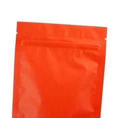 an orange plastic bag on a white background