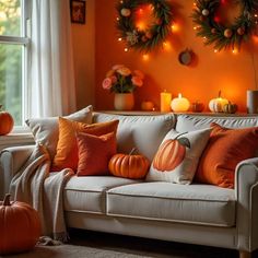 a living room filled with lots of furniture and decorations on top of each other in front of a window