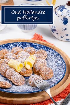 powdered sugar covered pastries on a blue and white plate with the words oud hollandse porferies