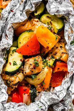 chicken, zucchini and tomatoes wrapped in foil