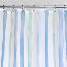 a shower curtain with blue and green stripes