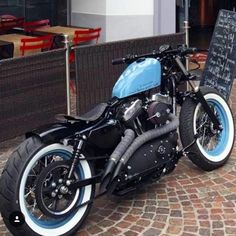 a motorcycle parked in front of a restaurant