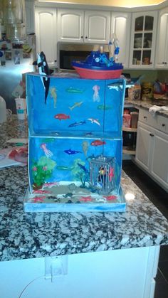 a fish tank sitting on top of a kitchen counter