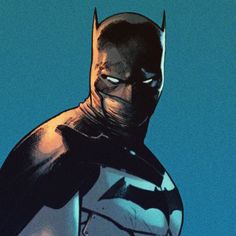 the batman standing in front of a blue sky