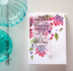 a close up of a card on a table with two vases and a paper plate