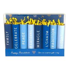 four blue candles with gold confetti on them