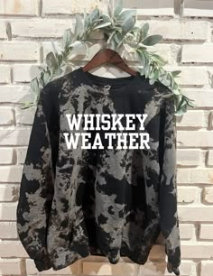 Embrace the cozy vibes with our Whiskey Weather tie dye sweatshirt, a must-have for any whiskey aficionado. Handmade with love, it's the perfect trendy yet comfy gift for her, ideal for celebrating any occasion. The sweatshirts are hand bleached and no two are the same. Colors vary from black, gray and brown. I use Gildan 50/50 blend. Relaxed Fit Tie Dye Sweatshirt With Graphic Print, Trendy Tie Dye Cotton Sweatshirt, Trendy Cotton Tie Dye Sweatshirt, Trendy Tie-dye Sweatshirt Relaxed Fit, Trendy Tie Dye Sweatshirt Relaxed Fit, Trendy Tie Dye Sweatshirt With Relaxed Fit, Trendy Tie-dye Sweatshirt For Winter, Trendy Tie Dye Sweatshirt For Winter, Tie Dye Long Sleeve Sweatshirt With Letter Print