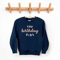 Looking for a cute sweatshirt for your kids? We have the perfect The Birthday Girl graphic sweatshirt addition to their closet! Also available in toddler sweatshirts. Fall Birthday Cotton Sweatshirt, Cotton Sweatshirt For Birthday In Winter, Cotton Sweatshirt For Winter Birthday, Cute Long Sleeve Sweatshirt For Birthday, Long Sleeve Winter Birthday Sweatshirt, Cute Crew Neck Birthday Sweater, Cute Crew Neck Sweater For Birthday, Long Sleeve Fall Birthday Sweatshirt, Winter Birthday Sweatshirt With Letter Print