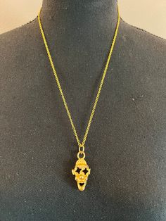 A unique gold-colored "skull" pendant, one of a kind. Hand Cast Gold Plated Jewelry, Hand Cast Gold Metal Necklace, Hand Cast Gold Brass Necklace, Gold Hand Cast Amulet Jewelry, Gold Hand Cast Brass Necklace, Hand Cast Gold Necklace In Metal, Yellow Gold Skull Jewelry For Gift, Hand Cast Skull Necklace As Gift, Hand Cast Skull Necklace For Gift