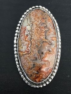 This crazy lace agate is crazy cool! Gorgeous earth tones throughout and this piece was handmade in sterling silver.  It weighs 14 grams.  Chain not included. Artisan Silver Jasper Jewelry, Earthy Sterling Silver Jewelry, Silver Sterling Silver Jewelry, Bohemian Silver Jasper Jewelry, Silver Ocean Jasper Bohemian Jewelry, Unique Silver Ocean Jasper Jewelry, Silver Bohemian Ocean Jasper Jewelry, Glendale Az, Dragon Ring