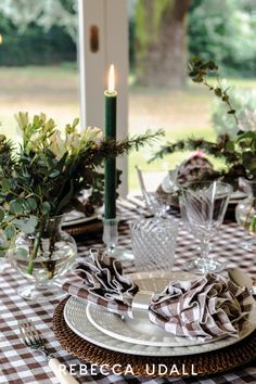 the table is set with dishes and place settings