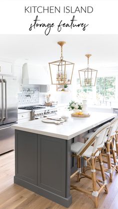 the kitchen island is surrounded by stools and pendant lights that are hanging from the ceiling