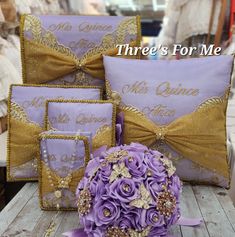 purple and gold wedding decorations on display at a vendor's booth with the words, three's for me