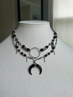 A continuation of my witchy theme. im thinking of starting a collection of witch necklaces.  This is a handmade necklace that can be worn as a choker or as a bit of a longer necklace. Made with black, grey, marble and metallic jewels and charms. Also has a beautiful black crescent pendant. Inspired from a dark witch or dark acedemia aesthetic. Perfect as a gift or to wear on special occasions.  nickel free Witchy Necklace Layering, Witch Costume Jewelry, Halloween Witch Jewelry, Witch Necklaces, Witch Necklace Pendants, Witches Necklace, Witchy Necklace, Crescent Pendant, Witch Accessories