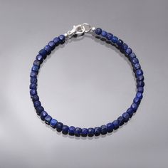 "Product Details : Item Code : DGC4219 Gemstone Name : LAPIS LAZULI Chain Style : BEADED Beads Shape : FACETED CUBE Beads Size : 4 mm Approx. Length : 8\" Inch Approx. Weight : 30 Cts. Approx. Customization : **Available** Please Feel Free To Contact If You Have Any Query." Lapis Lazuli Gemstone Beaded Bracelets, Lapis Lazuli Beaded Bracelets With Gemstone, Adjustable Lapis Lazuli Beaded Bracelet With Faceted Beads, Lapis Lazuli Beaded Bracelets As Gift, Gift Lapis Lazuli Beaded Bracelets With Polished Beads, Hand-strung Lapis Lazuli Beaded Bracelets, Beaded Beads, Cube Beads, Semi Precious Stone