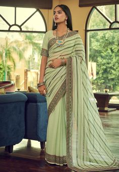 Georgette Saree with blouse in Pista green colour 29005 Desc: Color : Pista Green Fabric : Georgette Work : Printed Sequence Wash Care : Dry clean Sleeve Style : Half Sleeve Long Sleeves : Done only in Custom Stitch Sleeves Lining : Done only in Custom Stitch Bust Size : 32 to 42 Inches Occasion : Festival Diwali Eid Durga Pooja Ganesh Charturthi Dussehra. With Express Free Shipping Buy Indian Party wedding wear Bridal Sarees Georgette Saree with blouse in Pista green colour 29005 online in USA, Pista Green, Floral Saree, Traditional Saree, Embroidered Saree, Indian Sarees Online, Bandhani Saree, Satin Saree, Half Sleeve Blouse, Tussar Silk Saree