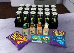 an assortment of drinks and snacks on a counter