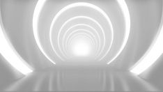 an abstract white tunnel with light at the end and no one in sight on the other side