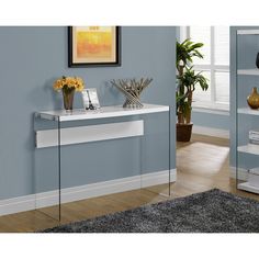 a white console table in a blue room