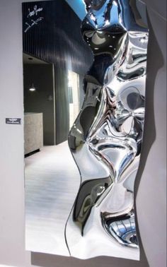 a mirror that is reflecting the reflection of a woman's body in it,