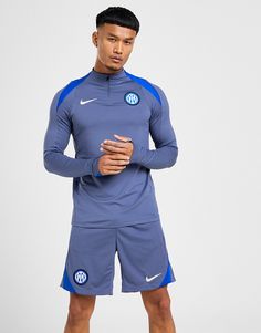 Hit the pitch in this men's Inter Milan Strike Drill Top from Nike. In a Diffused Blue colourway, this slim-fit top is made with smooth, lightweight poly fabric with extra stretch for supreme comfort. It's crafted with sweat-wicking Dri-FIT tech, and features a quarter zip fastening with a raised collar to adjust your airflow. It has long sleeves with thumb loops for a secure and streamlined fit, and is finished with signature Swoosh branding to the chest. Signed off with an Inter Miami team badge to highlight your pride. Machine washable. Nike React Vision, Team Badge, 270 Nike, Inter Miami, Slim Fit Top, Football Training, Inter Milan, The Pitch, Blue Nike