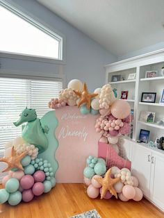 an ocean themed birthday party with balloons and decorations