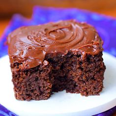 a piece of chocolate cake on a white plate