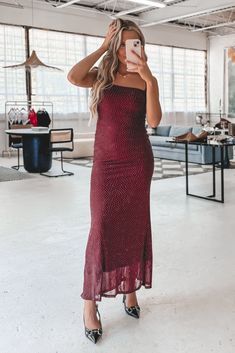 The color of the season & it's a stunning maxi dress?! Oh she is STYLISH!! Burgundy sleeveless studded maxi dress, fitted, has some stretch, dress is lined Material is Nylon Hang to dry Model is 5'5 wearing a small SHOP THE LOOK