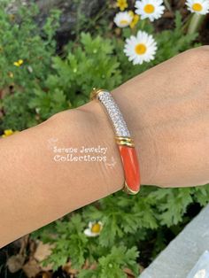 Beautiful cheerful coral diamond 18k solid yellow gold bangle bracelet. The gold has intricate engraved designs while a section of coral displays beautiful Japanese Momo color. Estimated diamond weight is 0.75 carats. Total Weight: 31.71 grams Bracelet length: 6.5 inches Precious Metal: 18k yellow gold Precious stones: -Coral: 28.5mm x 7.2mm -White Round Diamonds: 0.75 carat Hallmark: 750 Luxury Round Coral Jewelry, Elegant Orange Bangle Bracelet, Luxury Coral Jewelry For Formal Occasions, Elegant Coral Jewelry For Anniversary, Elegant Orange Jewelry With Diamond Accents, Elegant Orange Bangle Jewelry, Luxury Coral Jewelry For Gifts, Luxury Coral Jewelry For Gift, Elegant Coral Bracelet For Gift