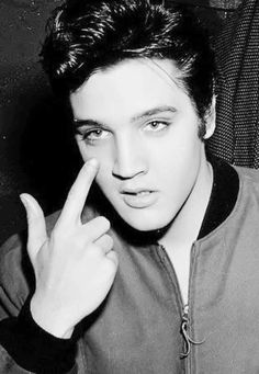 a young man making the middle finger sign