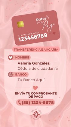 a pink credit card sitting on top of a white sheet with writing in spanish and english