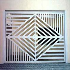 an image of a white gate on the side of a building with black and white lines