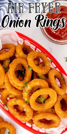 air fryer onion rings in a basket with ketchup and parsley on the side