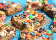 the cookie bars are decorated with colorful candy and m & m's on top