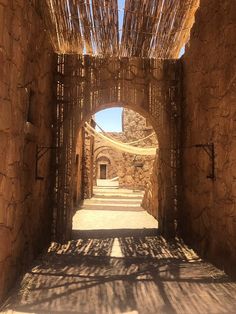 an archway in the middle of a stone building