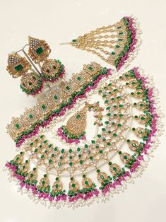 Most beautiful designer bridal set. Full complete set. Jhumkas  Choker Necklace  Jhoomer  Tika Green Wedding Sets With Tilla Embroidery, Bollywood Green Bridal Sets With Cutdana, Chandbali Bridal Sets With Zari Work For Reception, Green Traditional Wear With Stone Work For Wedding, Green Lehenga With Stone Work For Reception, Heavy Kundan Lehenga For Wedding, Traditional Hand Set Lehenga For Festive Occasions, Wedding Anarkali Set With Tilla And Kundan, Wedding Lehenga With Heavy Kundan Work