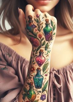 a woman's arm with tattoos on it